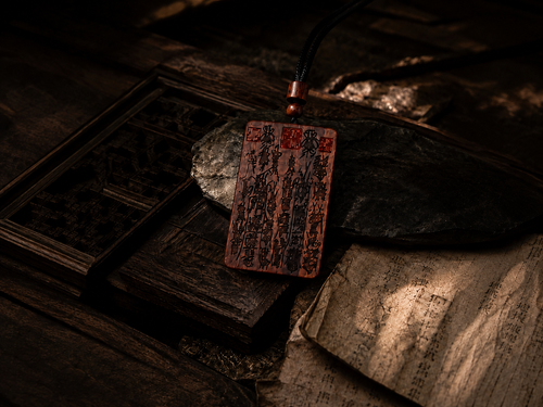 Carved wooden talisman pendant