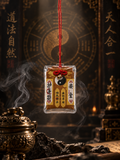 Brown and yellow Chinese talisman charm with yin-yang symbol and red hanging cord